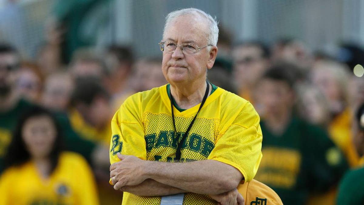 FILE- In the Sept. 12, 2015 file photo, Baylor President Ken Starr waits to run onto the field before an NCAA college football game in Waco, Texas. Baylor University officials say regents are still reviewing an investigation into how the Texas school handled reports of rape and assault by football players and expect to announce any actions by June 3, 2016. Baylor issued the statement Tuesday, May 24, 2016, after reports that President Ken Starr was fired. The school said it would not respond to "rumors." (AP Photo/LM Otero, File)