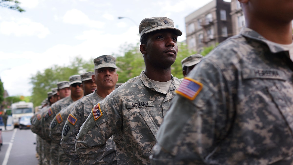 NEW YORK, NY - MAY 18:  Memebrs of the Army's 369th Infantry Regiment prepare to march with fellow soldiers, boy scouts and various other military aligned groups in the 369th Infantry Regiment Parade in Harlem on May 18, 2014 in New York City. The parade, which takes place on the historic Adam Clayton Powell Jr. Boulevard, looks to celebrate the contribution African Americans and Puerto Ricans have made to military. The 369th was home to the 