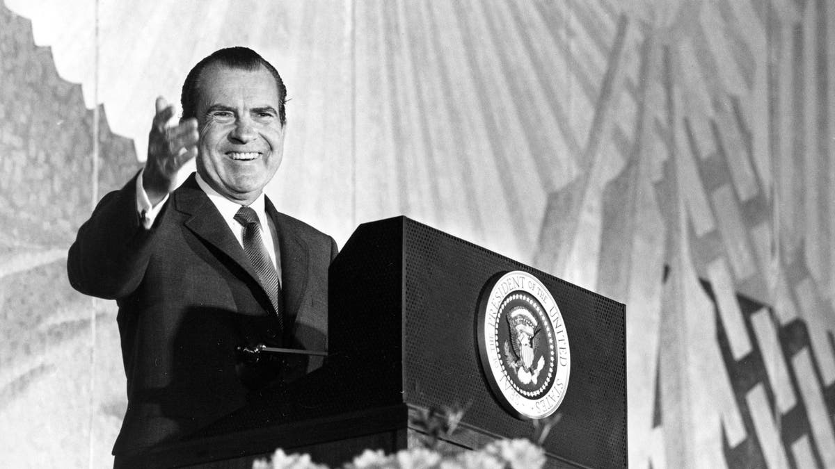 President Nixon appears in Washington, April 29, 1969, before the general session of the annual meeting of the U.S. Chamber of Commerce. Speaking on campus unrest, Nixon said dissent is welcome provided it is peaceful. "There can be no compromise with lawlessness and no surrender to force if free education is to survive in the United States of America," he added. (AP Photo)