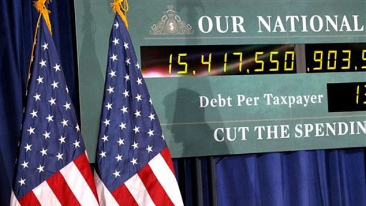 Feb. 24, 2012: A national debt clock is shown during a campaign event for Mitt Romney in Kalamazoo, Mich.