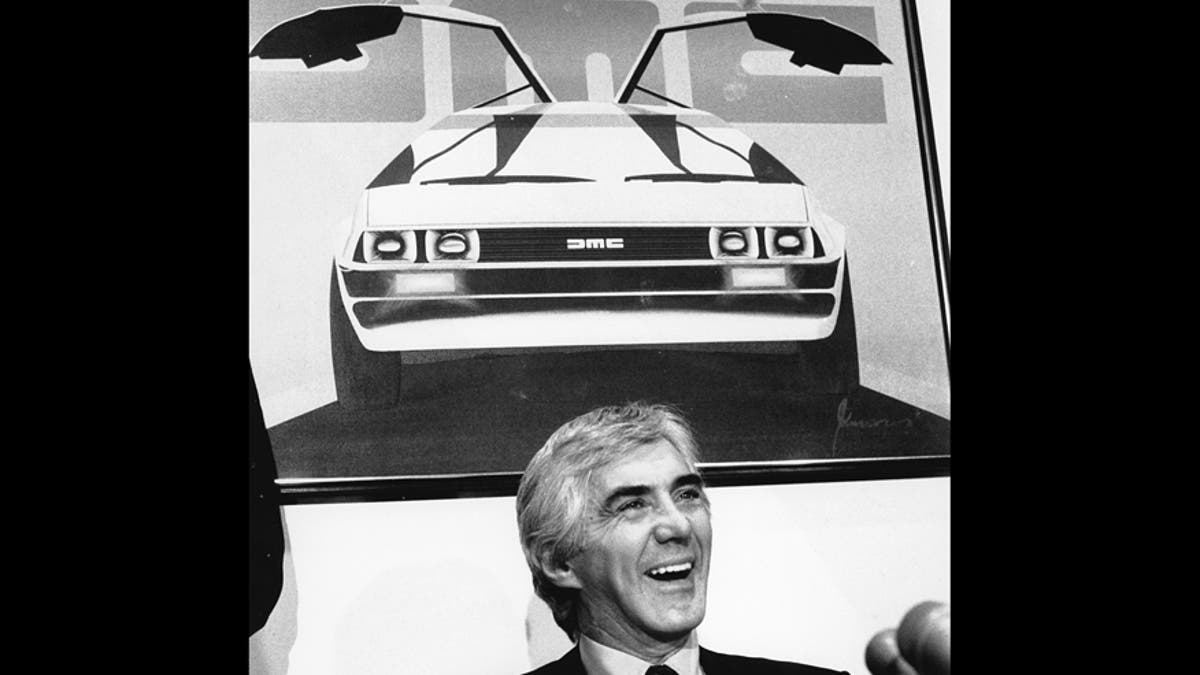John Z. DeLorean answers reporters' questions at his news conference in New York on Feb. 19, 1982. (AP Photo/Marty Lederhandler)
