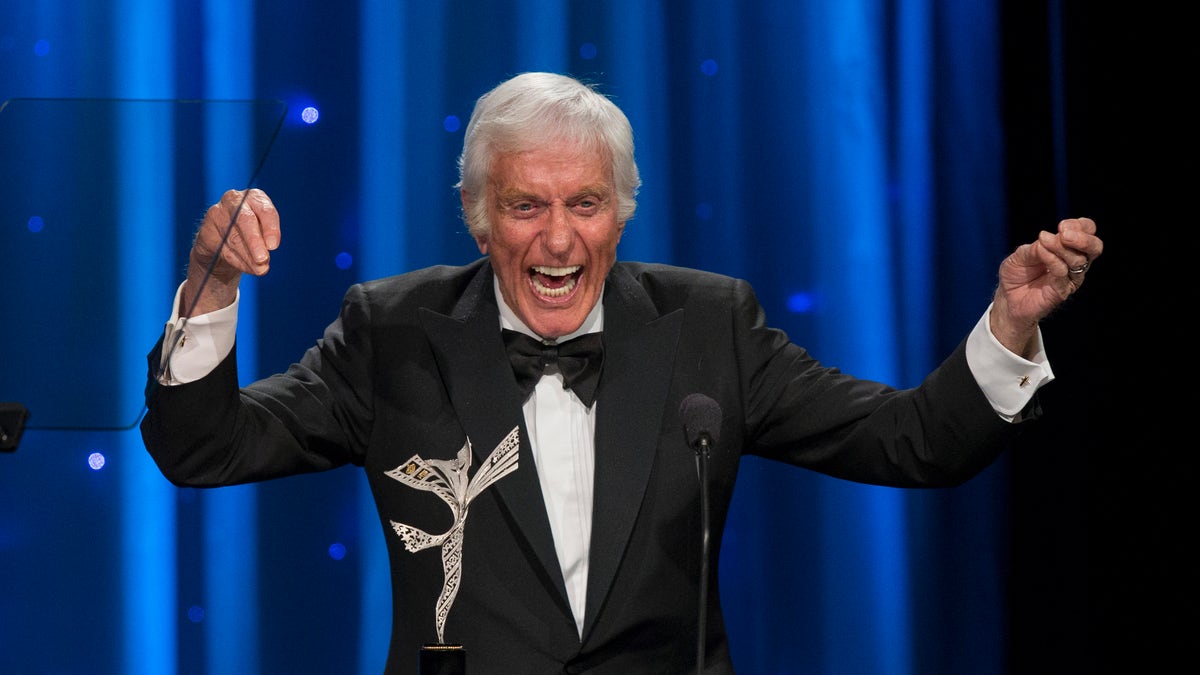 Actor Dick Van Dyke dances while accepting the Prince Rainier III Award at the 2014 Princess Grace Awards gala at the Beverly Wilshire hotel in Beverly Hills, California October 8, 2014. The Princess Grace Foundation-USA is a non-profit foundation dedicated to help emerging talent in theater, dance, and film by awarding grants.  REUTERS/Mario Anzuoni  (UNITED STATES - Tags: ENTERTAINMENT TPX IMAGES OF THE DAY ROYALS) - RTR49H2Y