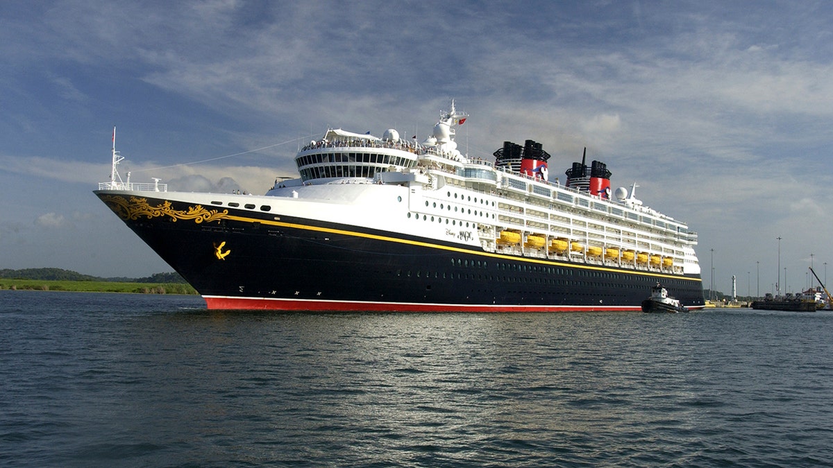 The Disney Magic cruise ship sails on a section of the Panama Canal May 16, 2008. The U.S.-owned cruise ship has paid a record $331,200 to cross the Panama Canal as vessels fight for space in the increasingly congested waterway, authorities said on June 10, 2008. The 964-foot (295-meter)-long Disney Magic, owned by a subsidiary of Walt Disney Co, broke the transit record on May 16, the Panama Canal Authority said. The ship sails out of Port Canaveral, Florida, and is registered in the Bahamas.  Picture taken May 16, 2008. REUTERS/Panama Canal Authority/Handout  (PANAMA) - GM1E46B0AU501