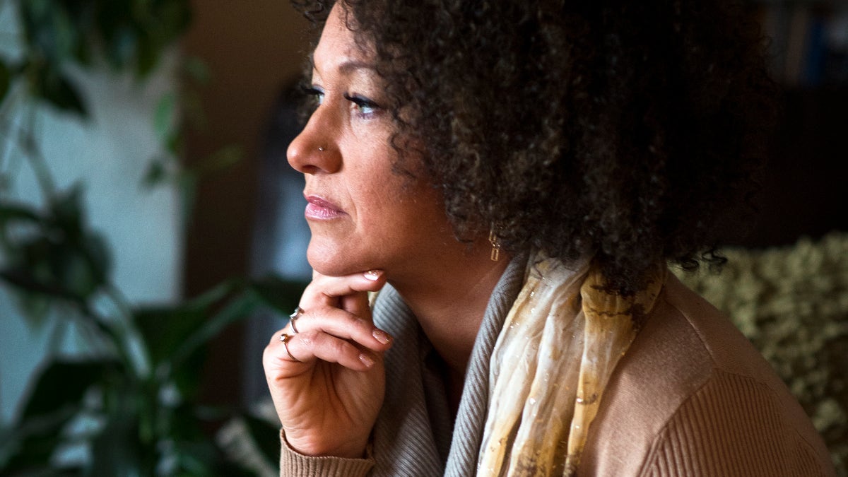 FILE- In this March 2, 2015 file photo, Rachel Dolezal, president of the Spokane chapter of the NAACP, poses for a photo in her Spokane, Wash. home. Dolezal is facing questions about whether she lied about her racial identity, with her family saying she is white but has portrayed herself as black, Friday, June 12, 2015. (Colin Mulvany/The Spokesman-Review via AP, File) COEUR D'ALENE PRESS OUT