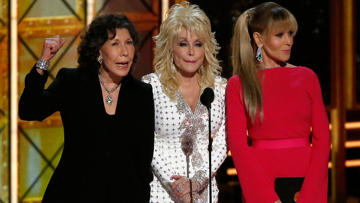 Dolly Parton (center) remained tight lipped when Lily Tomlin (left) and Jane Fonda (right) cracked a Trump joke at the 2017 Emmys.