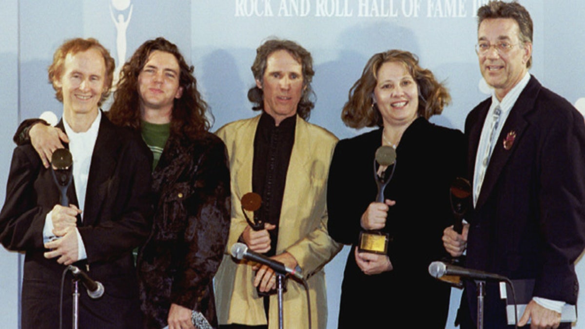 Members of The Doors pose after being inducted in the Rock 'n' Roll Hall of Fame. From left are guitarist Robby Krieger, Pearl Jam's Eddie Vedder (who presented the award), drummer John Densmore, Anne Cheuring (sister of the late Jim Morrison) and keyboardist Ray Manzarek.