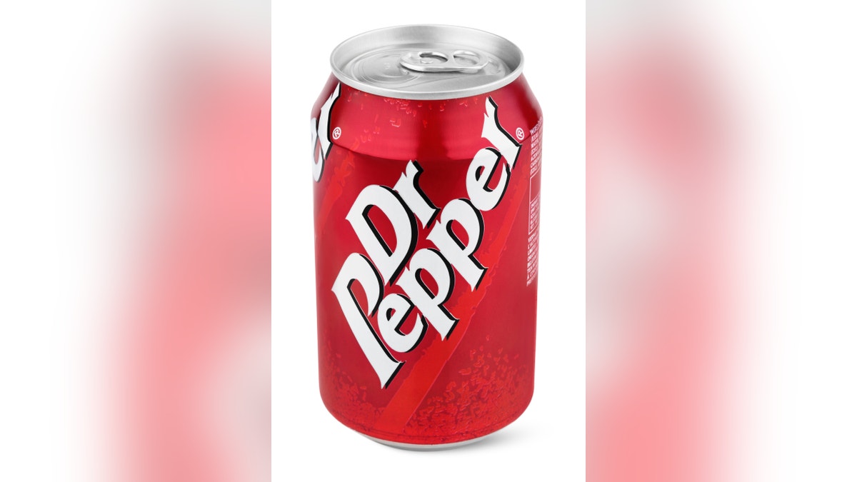 Closeup of aluminum red can of Dr Pepper isolated on white background with clipping path. Dr. Pepper is now manufactured by the Dr Pepper Snapple Group, Inc.