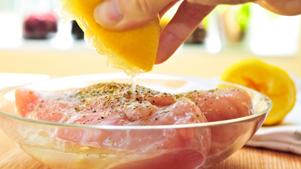 Raw chicken breasts marinating