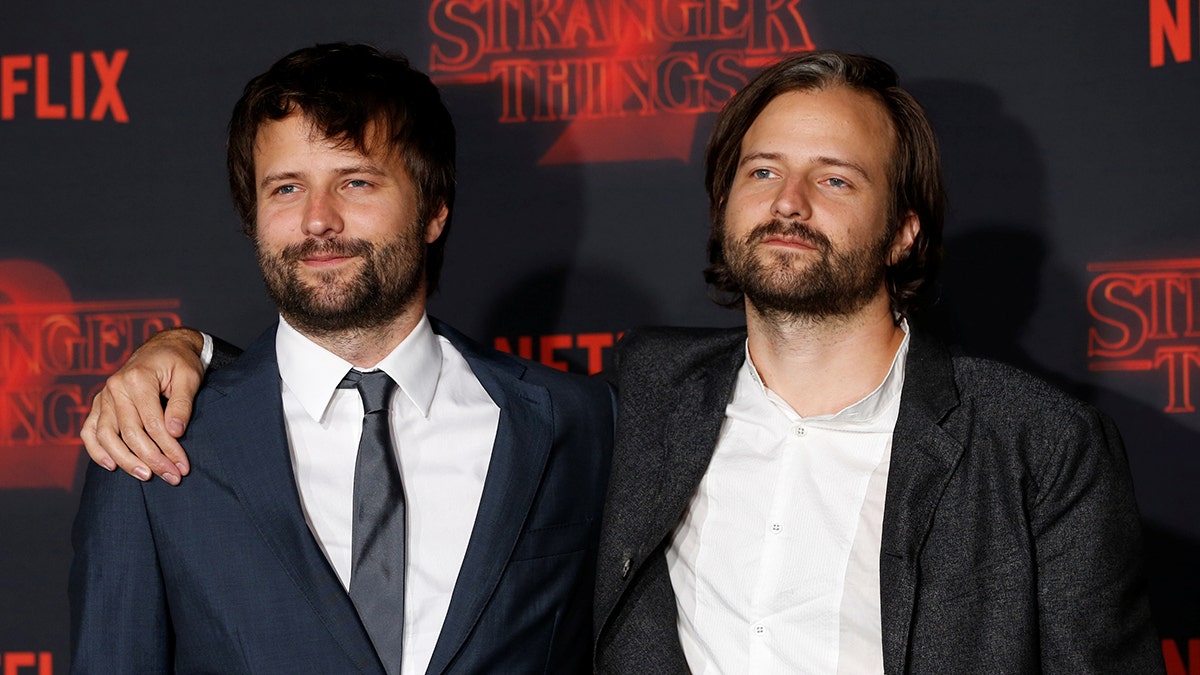 Series creators Ross (L) and Matt Duffer pose at the premiere for the second season of the television series 