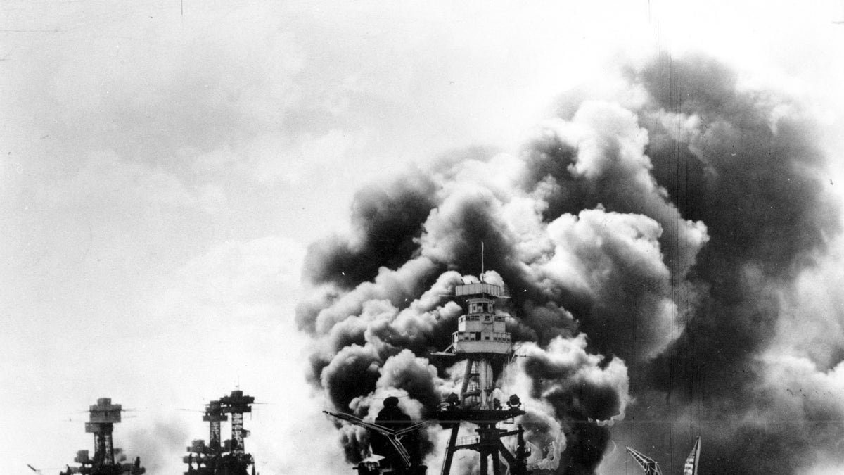 The USS West Virginia, Tennessee, and Arizona battleships are shown damaged and burning after the Japanese attack on Pearl Harbor, Hawaii, in 1941. "I wanted to help save our country," said veteran Stanley Tauber of New York about his entry into the service when he was a very young man. Tauber is now 102 years old.