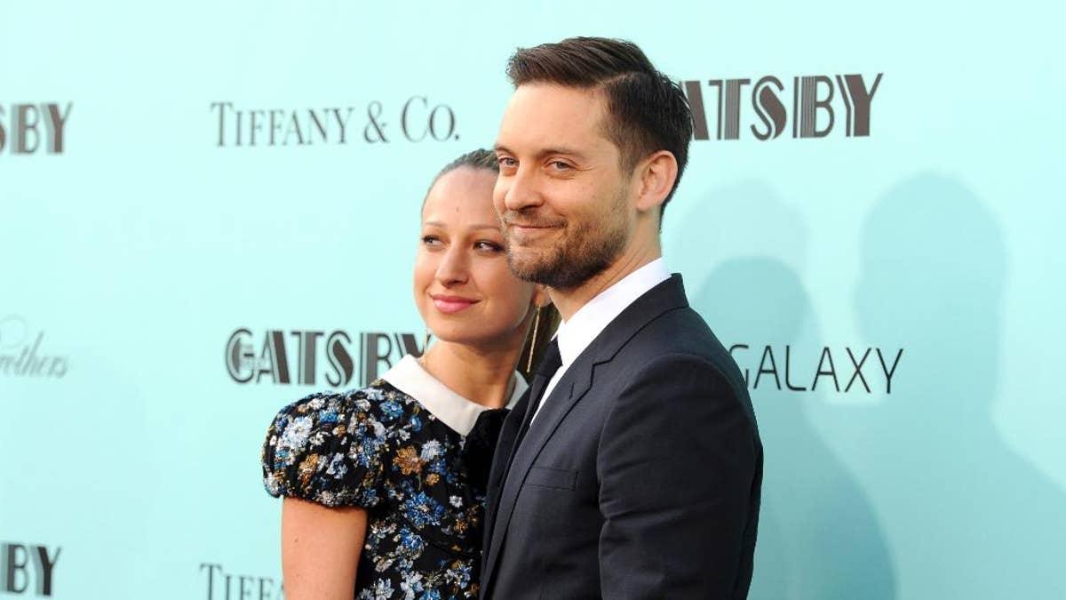 FILE - In this May 1, 2013, file photo, actor Tobey Maguire, right, and wife Jennifer Meyer attend 