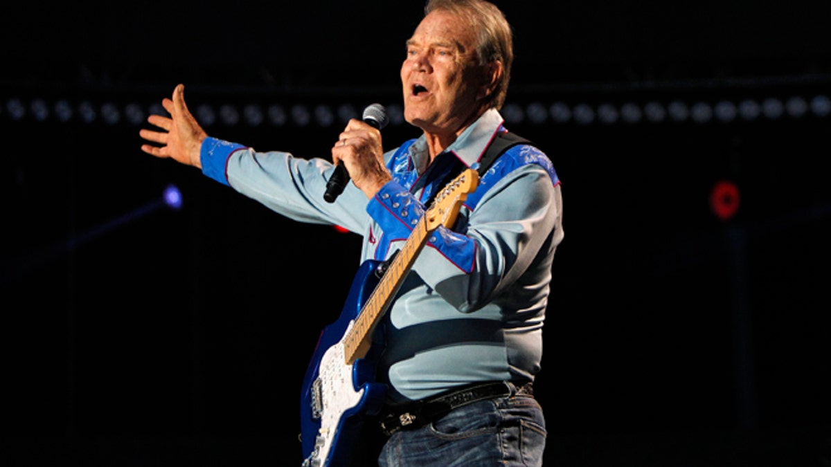 American country music artist Glen Campbell performs during the Country Music Association (CMA)  Music Festival in Nashville, Tennessee June 7, 2012. REUTERS/Harrison McClary (UNITED STATES - Tags: ENTERTAINMENT) - RTR339QK