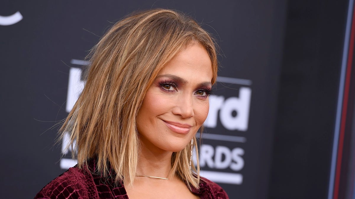 FILE - In this May 20, 2018 file photo, Jennifer Lopez arrives at the Billboard Music Awards in Las Vegas. MTV announced Tuesday, July 31, that Lopez would receive the Michael Jackson Video Vanguard Award on Aug. 20 at Radio City Music Hall in New York. Lopez, who last performed at the VMAs in 2001, will also perform at the awards show. (Photo by Jordan Strauss/Invision/AP, File)