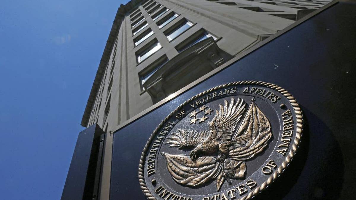 FILE - In this June 21, 2013, file photo, the seal a fixed to the front of the Department of Veterans Affairs building in Washington. The Republican-led House on March 16, 2017, has approved legislation to make it easier for the Department of Veterans Affairs to fire, suspend or demote employees for poor performance or bad conduct, part of a renewed effort targeting VA accountability in the new Trump administration. (AP Photo/Charles Dharapak, File)