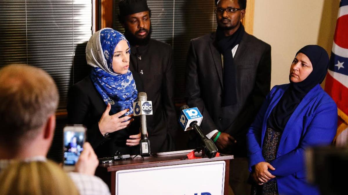 Roula Allouch, board chair of the Council On American-Islamic Relations, left, speaks during a news conference regarding an earlier attack at the Ohio State University campus, Monday, Nov. 28, 2016, in Dublin, Ohio. A Somali-born Ohio State University student plowed his car into a group of pedestrians on campus and then got out and began stabbing people with a knife Monday before he was shot to death by an officer. (AP Photo/John Minchillo)