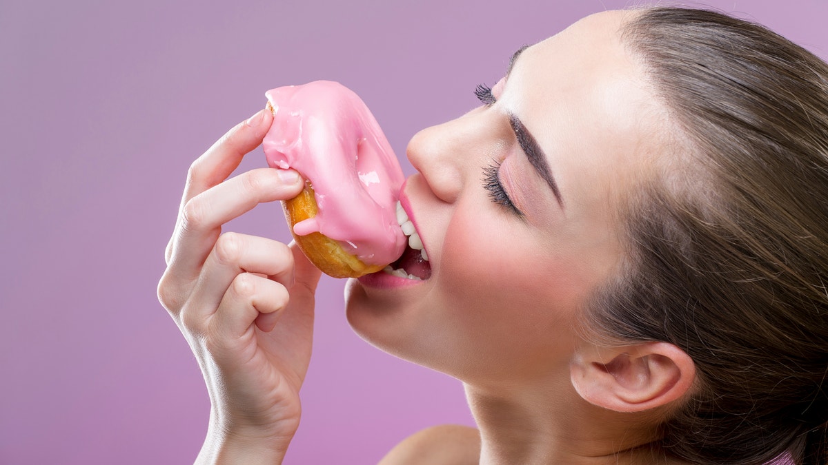 eating a donut istock large