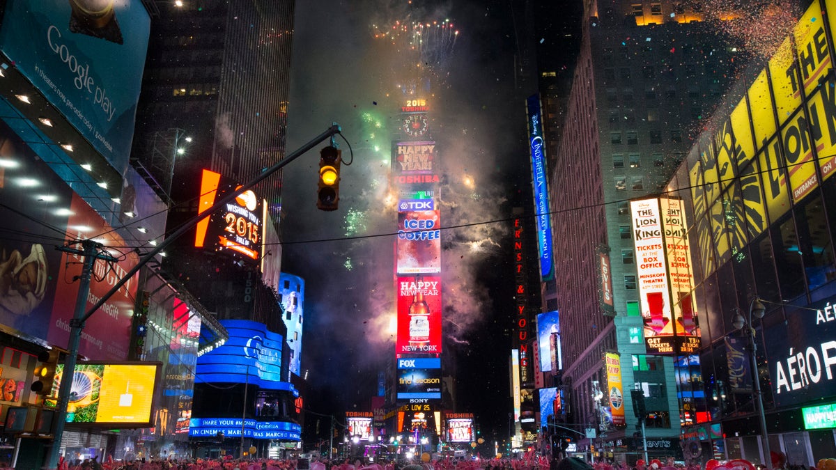 Fireworks erupt after midnight in Times Square during the New Year's Eve celebration, Thursday, Jan. 1, 2015, in New York. Thousands braved the cold to watch the annual ball drop and ring in the new year. (AP Photo/John Minchillo)