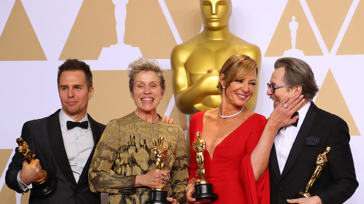 90th Academy Awards - Oscars Backstage - Hollywood, California, U.S., 04/03/2018 - Oscar winners Sam Rockwell, Frances McDormand, Allison Janney and Gary Oldman (L to R) pose backstage. REUTERS/Mike Blake - HP1EE350F1OFS