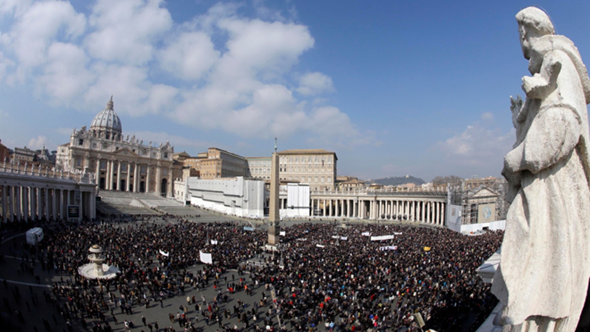 Faithful gather to listen to pope Benedict XVI's Angelus prayer in St. Peter's square at the Vatican, Sunday, Feb. 17, 2013. Pope Benedict XVI blessed the faithful from his window overlooking St. Peter's Square for the first time since announcing his resignation, cheered by an emotional crowd of tens of thousands of well-wishers from around the world. (AP Photo/Gregorio Borgia)