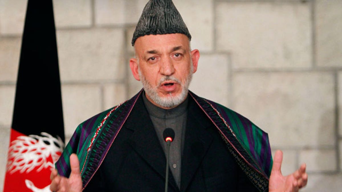 Dec. 14, 2011: Afghan President Hamid Karzai speaks during a joint news conference with U.S. Defense Secretary Leon Panetta, unseen, at the presidential palace in Kabul, Afghanistan.