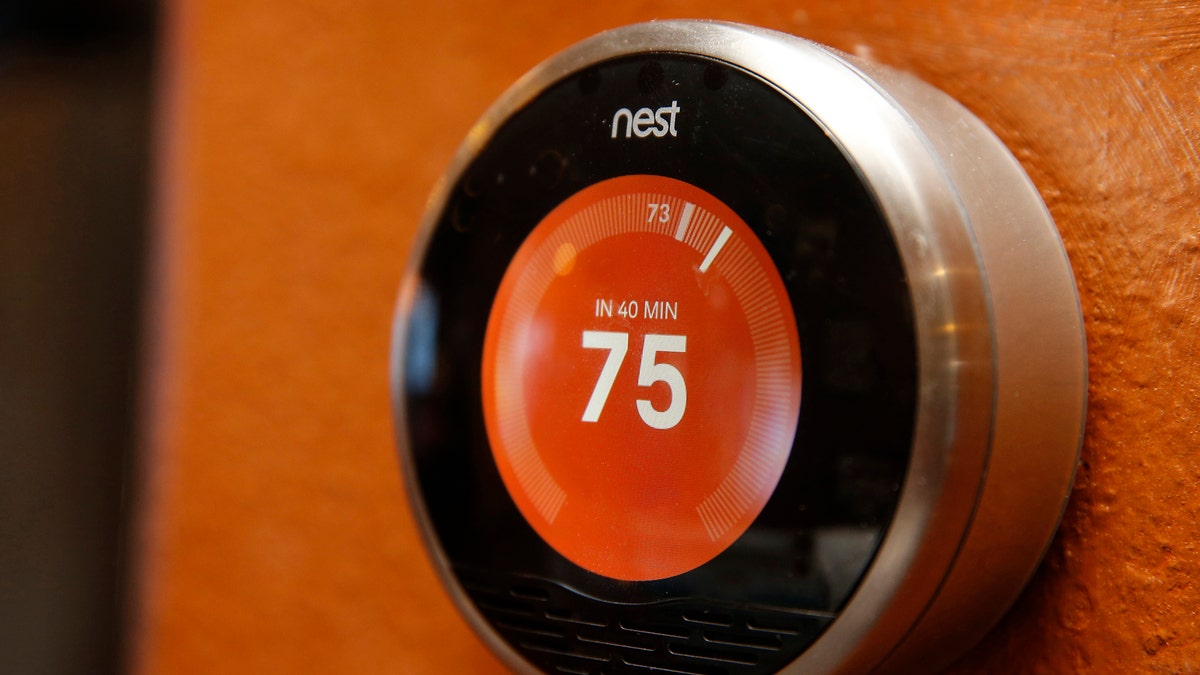 A Nest thermostat is installed in a home in Provo, Utah, January 15, 2014. Google Inc took its biggest step to go deeper into consumers' homes, announcing a $3.2 billion deal January 13, 2014 to buy smart thermostat and smoke alarm-maker Nest Labs Inc, scooping up a promising line of products and a prized design team led by the "godfather" of the iPod. REUTERS/George Frey (UNITED STATES - Tags: BUSINESS SCIENCE TECHNOLOGY) - RTX17ON5