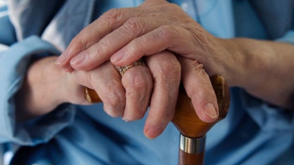 Senior Patient Hands and cane