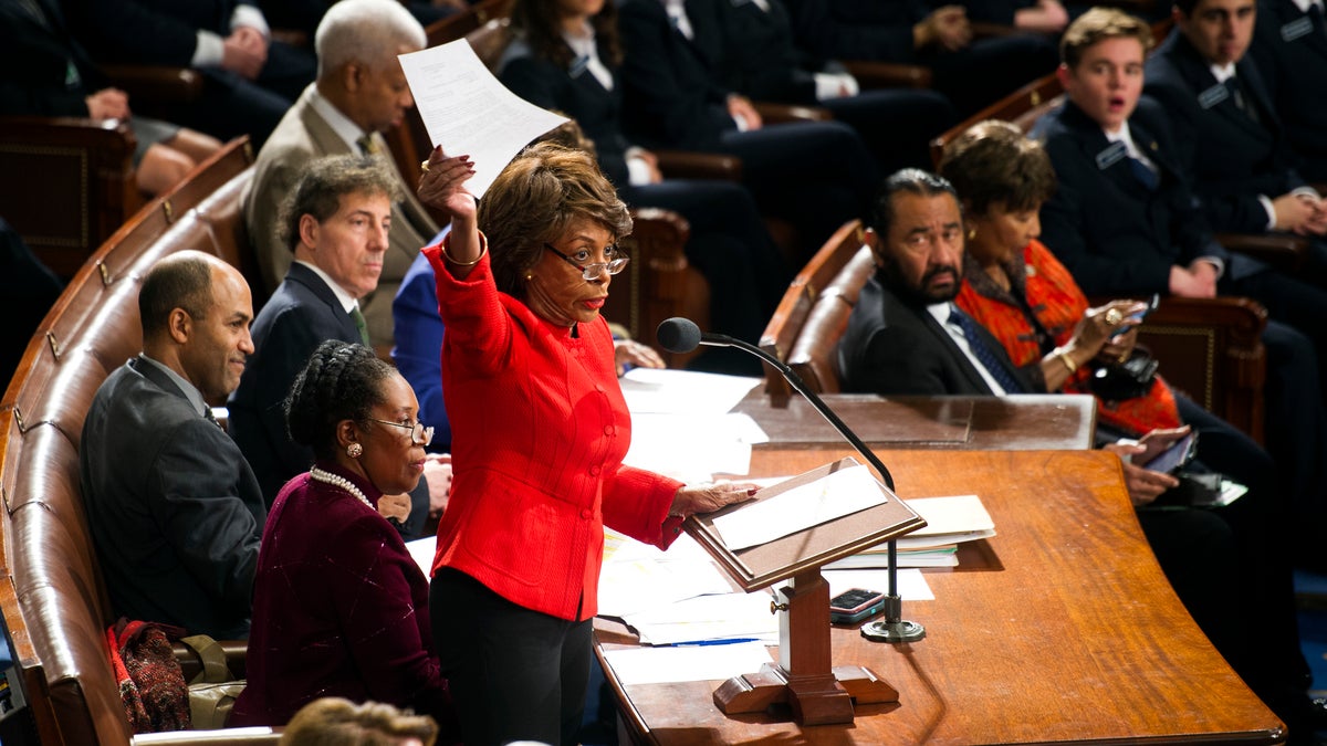 Rep. Maxine Waters, D-Calif., holds up a written objection to the Electoral College vote and calls on a Senator to join in the objection during a joint session of Congress to count the electoral ballots, on Capitol Hill in Washington, Friday, Jan. 6, 2017. Congress certified Donald Trump's presidential victory over the objections of a handful of House Democrats, with Vice President Joe Biden pronouncing, 
