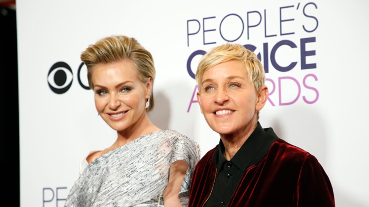 Actress Portia de Rossi and television personality Ellen DeGeneres pose backstage at the People's Choice Awards 2017 in Los Angeles, California, U.S., January 18, 2017. REUTERS/Danny Moloshok - RTSW6CK