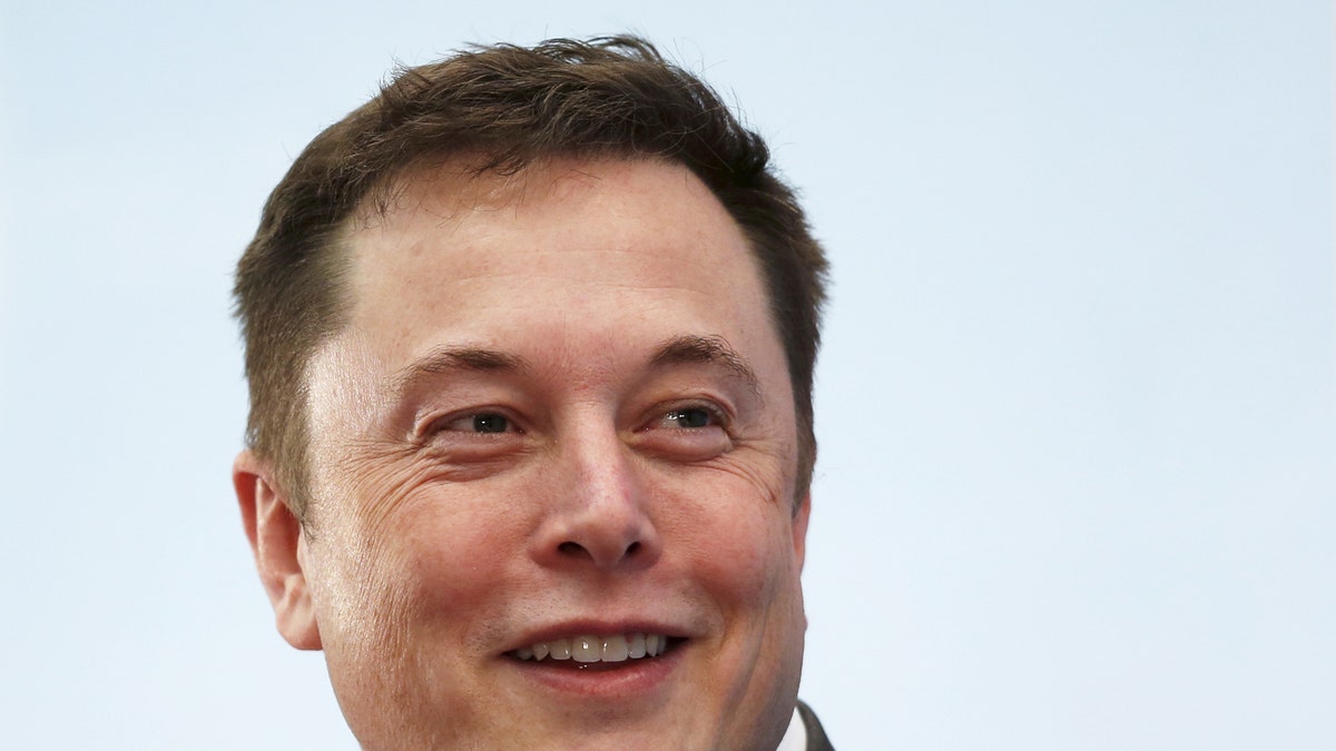 Tesla Chief Executive Elon Musk smiles as he attends a forum on startups in Hong Kong, China January 26, 2016. Musk gave a public shout-out to the sharpest minds in manufacturing this week, calling on them to come help Tesla Motors Inc build a million electric cars a year by 2020. REUTERS/Bobby Yip/File Photo - RTX2D6RR