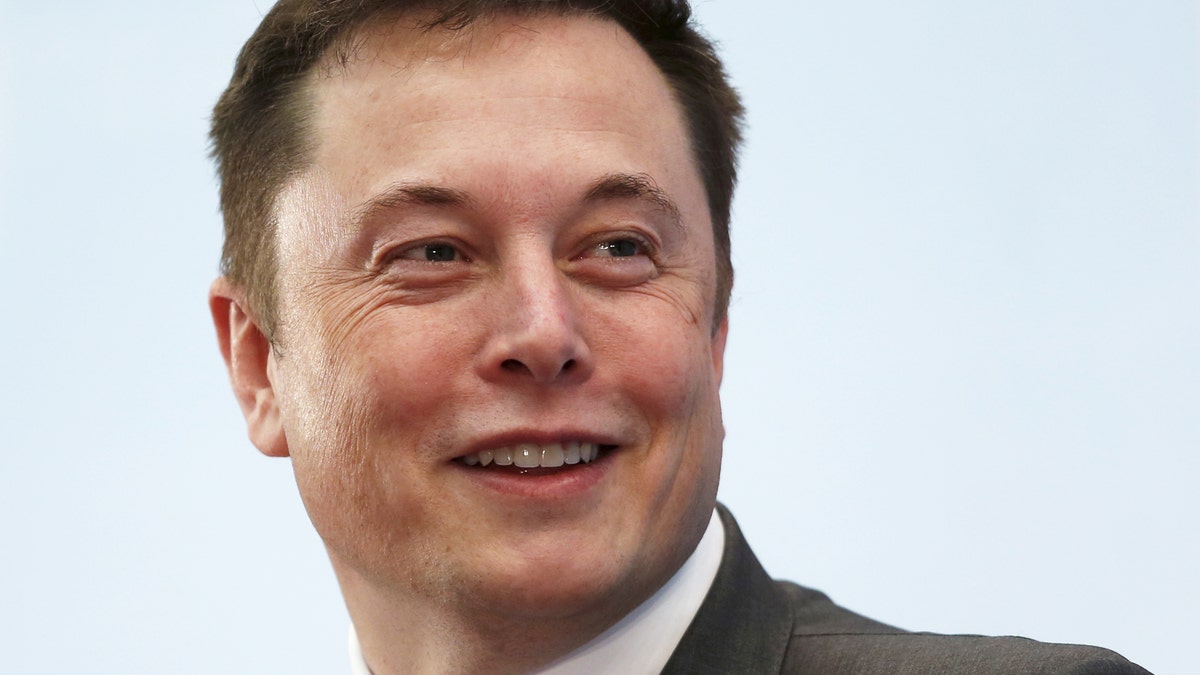 Tesla Chief Executive Elon Musk smiles as he attends a forum on startups in Hong Kong, China January 26, 2016. Musk gave a public shout-out to the sharpest minds in manufacturing this week, calling on them to come help Tesla Motors Inc build a million electric cars a year by 2020. REUTERS/Bobby Yip/File Photo - RTX2D6RR