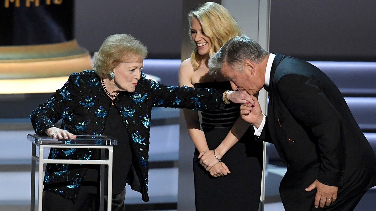 LOS ANGELES, CA - SEPTEMBER 17:  (L-R) Betty White, Kate McKinnon, and Alec Baldwin speak onstage during the 70th Emmy Awards at Microsoft Theater on September 17, 2018 in Los Angeles, California.  (Photo by Kevin Winter/Getty Images)