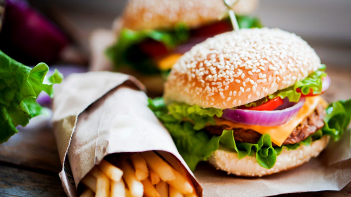 Closeup of home made burgers on wooden background