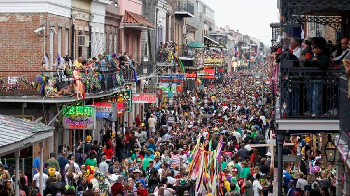 Mardi Gras crowds flood Bourbon Street