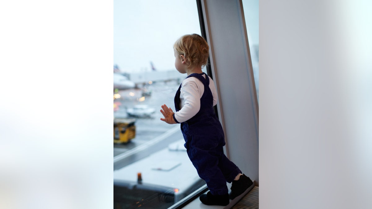 Kid in the airport.