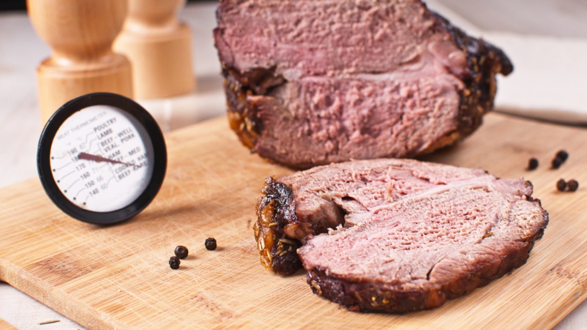 Roasted meat slice and thermometer