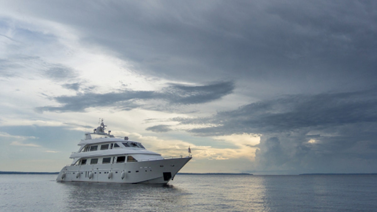 Boat entering storm with calm water