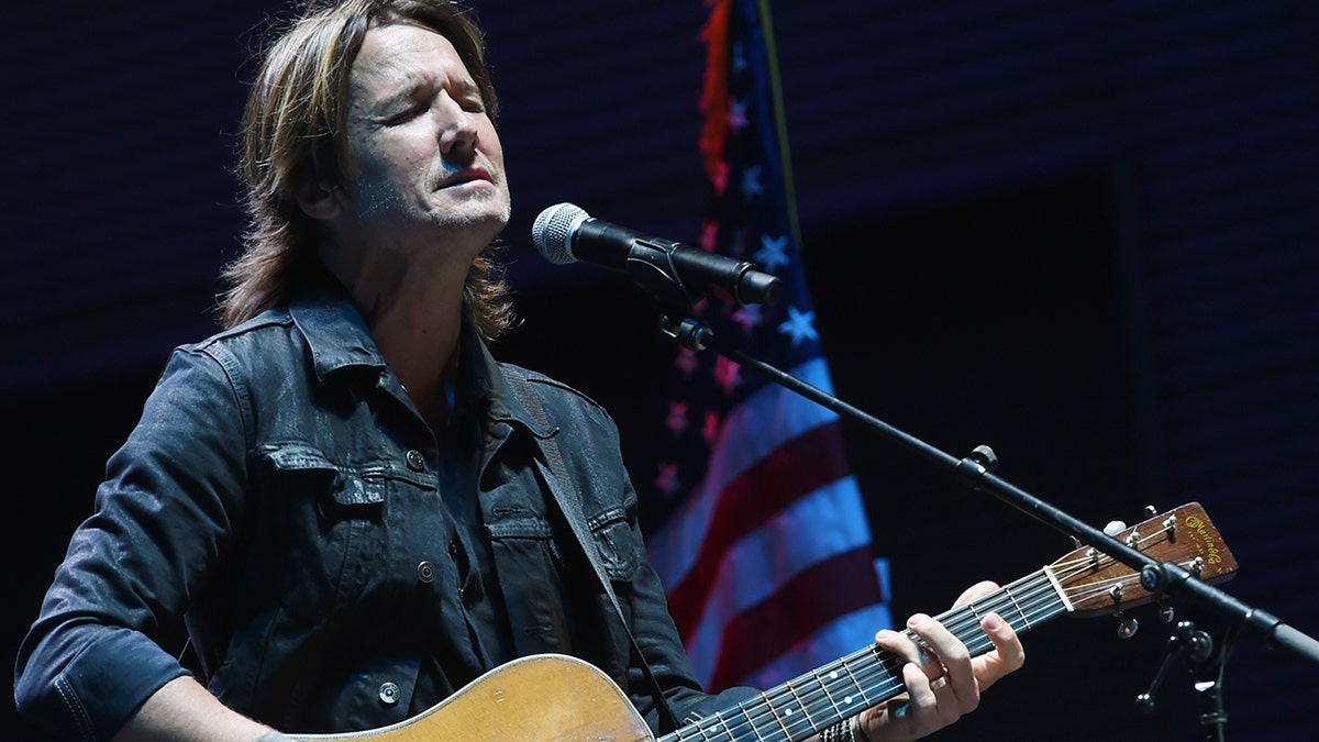 Keith Urban performs 'Bridge Over Troubled Water' during Nashville Candelight Vigil For Las Vegas at Ascend Amphitheater on October 2, 2017 in Nashville, Tennessee. 