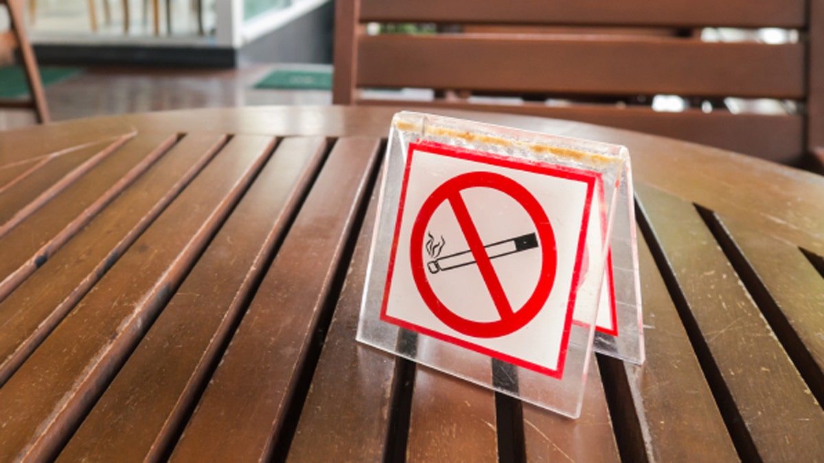 no smoking sign displayed on a table