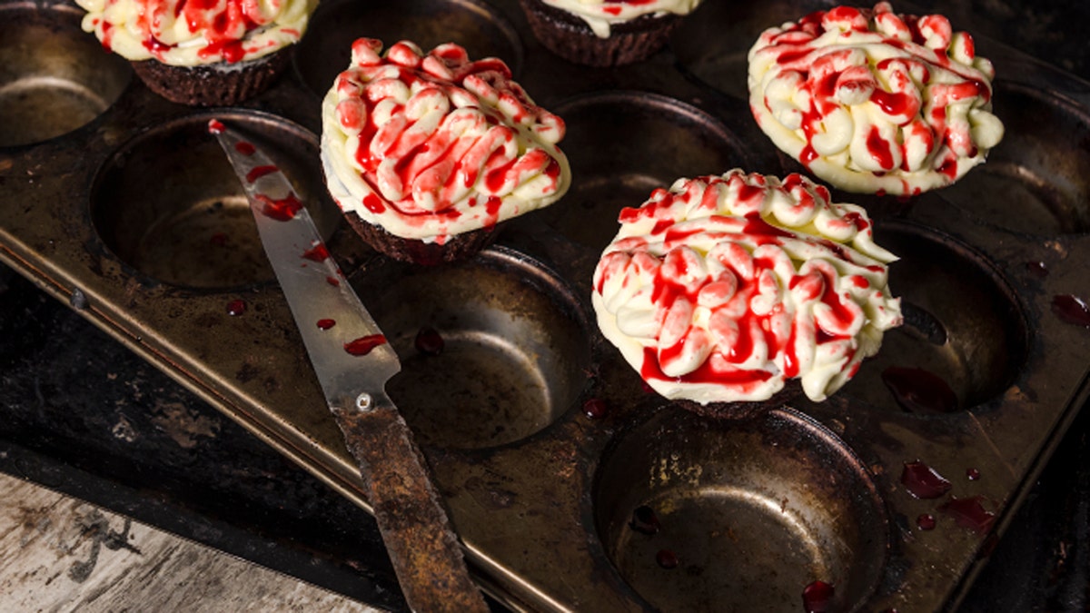 Chocolate pumpkin cupcake, blurred background