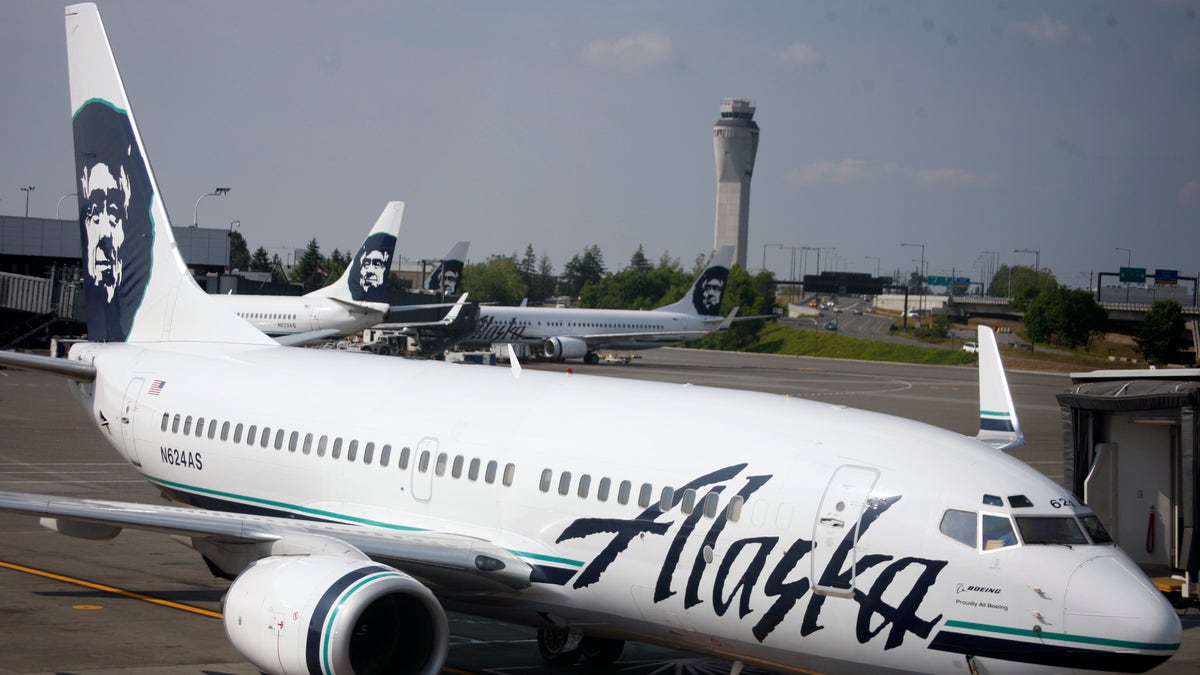 Earns Alaska Air Group