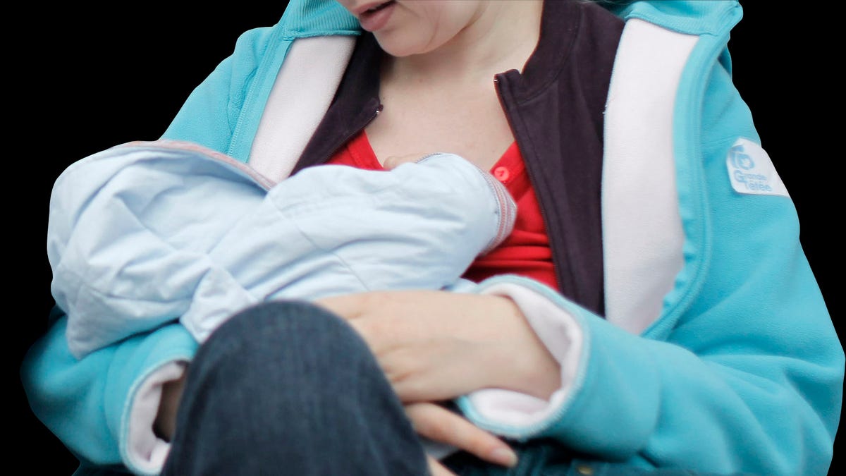 f0e350ca-** EDS NOTE NUDITY ** Mothers breastfeeding their babies in Paris, France, Sunday, Oct. 11, 2008, during a worldwide breastfeeding event.  Many French women gathered in Paris,  joining other women in other countries, in a bid to raise worldwide awareness of the benefits of breastfeeding babies, as part of the World Breastfeeding Week.  (AP Photo/Thibault Camus)