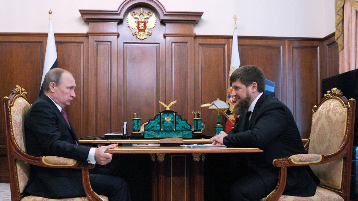 FILE - In this file photo taken on Friday, March 25, 2016, Russian President Vladimir Putin, left, meets with Chechen regional leader Ramzan Kadyrov in the Kremlin in Moscow, Russia. The leader of Chechnya says gay men do not exist in his republic and dismisses reports that 100 gay men have been rounded up, tortured and sometimes killed. (Mikhail Klimentyev, Sputnik, Kremlin Pool Photo via AP, File)