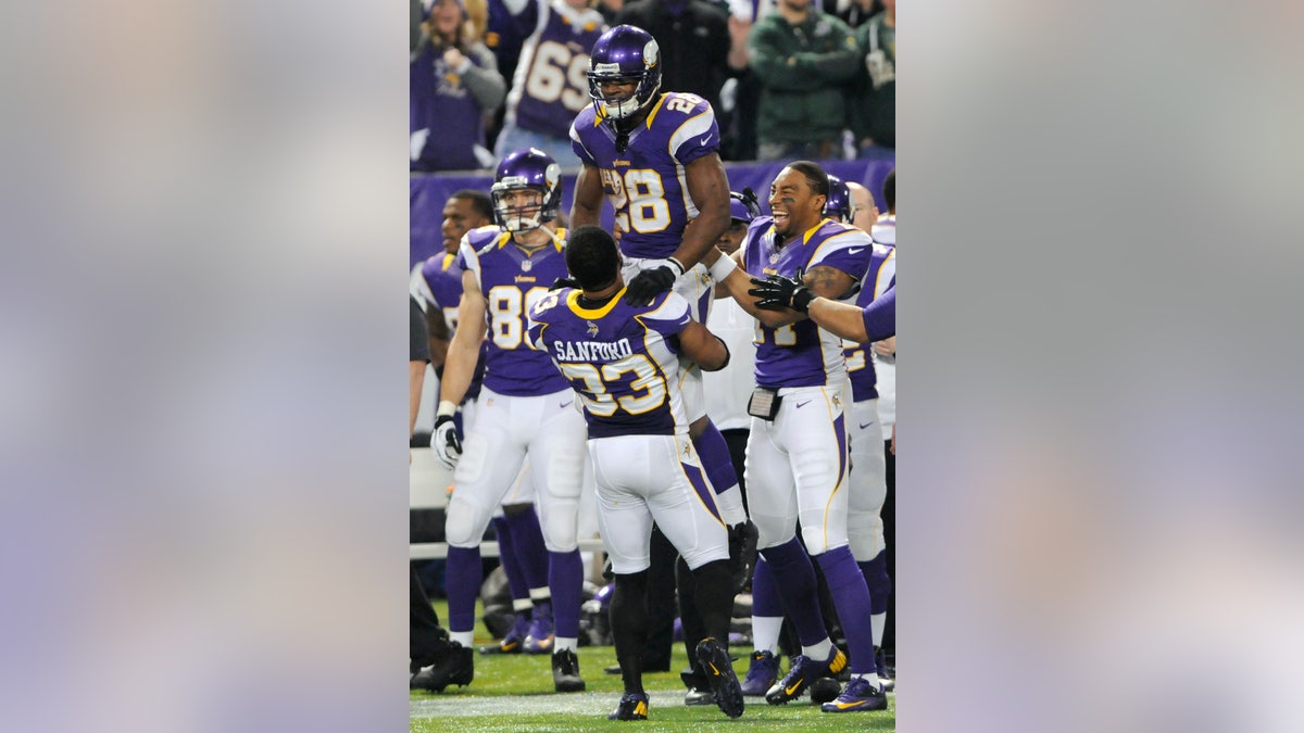 Adrian Peterson overcomes knee injury to win NFL MVP