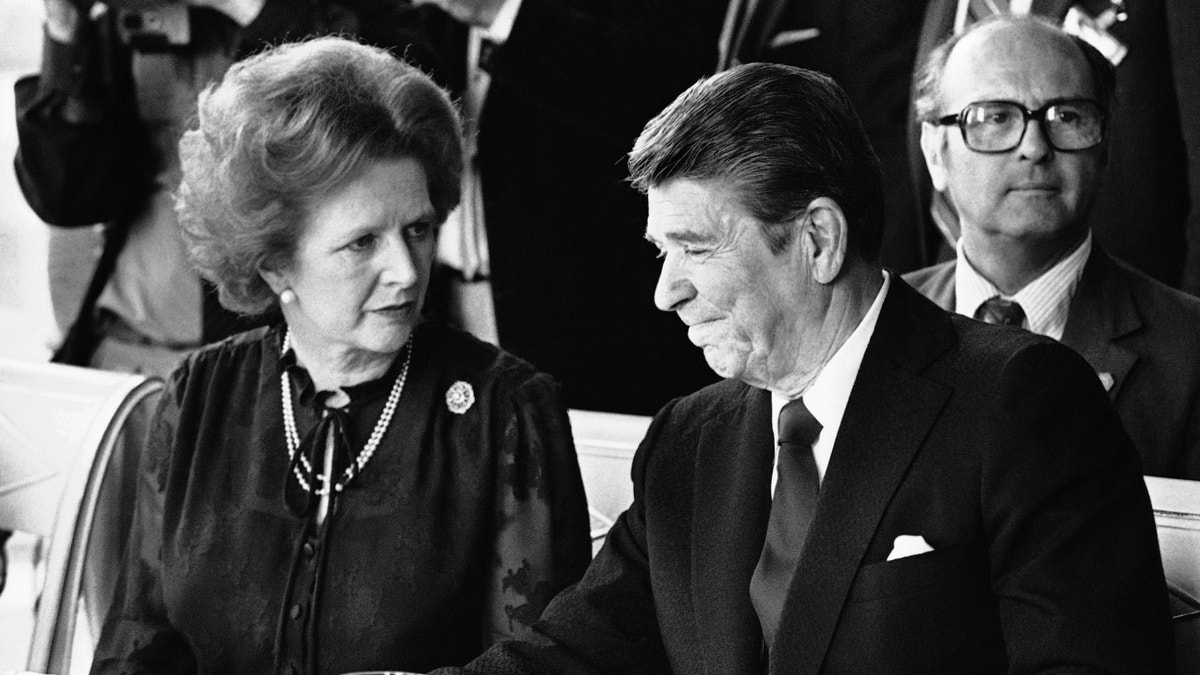 FILE - This is a Sunday, June 6, 1982 file photo of U.S. President Ronald Reagan and Britain's Prime Minister Margaret Thatcher at the lunch table, Sunday, June 6, 1982 at the Palace of Versailles, France, following the first session of the second days summit meeting. Margaret Thatcher felt betrayed by close ally Ronald Reagan over the Falkland Islands, according to newly released papers that reveal how isolated Britain's prime minister was in her determination to repel the Argentine invasion by force. When Argentina seized the British territory off the South American coast in April 1982, Thatcher's government presented a united front in public.(AP Photo/ File)