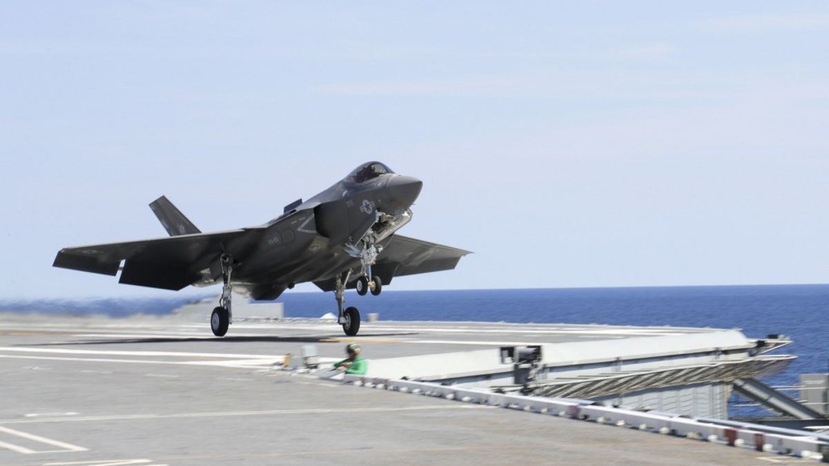 An F-35 fighter jet takes off from a US aircraft carrier