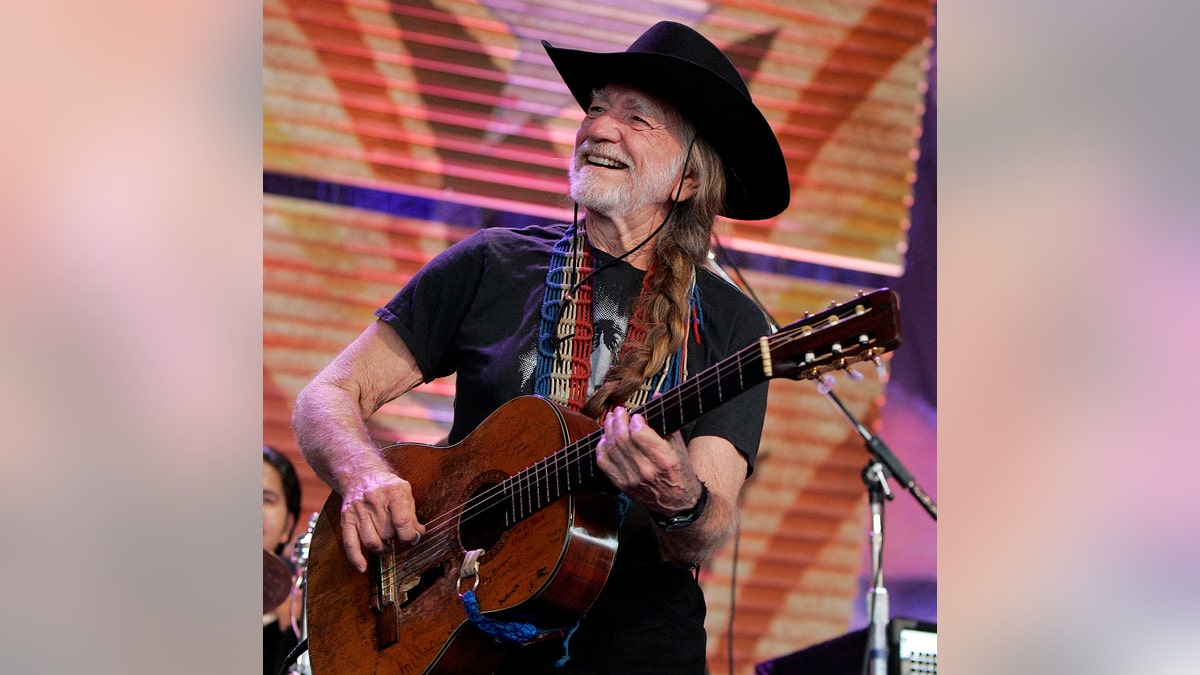 Willie Nelson performs with Los Lonely Boys during the 20th anniversary 