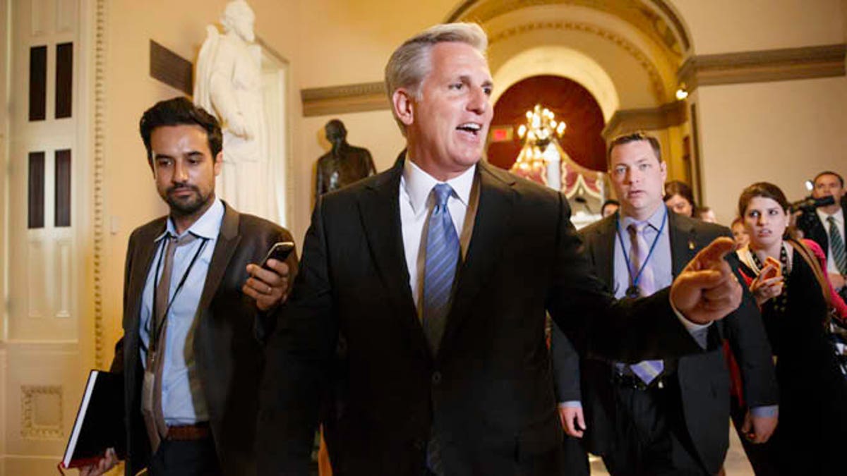In this photo taken June 11, 2014, House Majority Whip, Republican Kevin McCarthy of Calif., leaves House Speaker John Boehner's office on Capitol Hill in Washington. Emboldened conservatives are promising to make themselves heard on Capitol Hill like never before in the wake of Majority Leader Eric Cantor's surprise defeat to an unknown with tea party backing. That sets up the potential for struggles over Congress' most basic legislative responsibilities and dooms whatever slim hopes remained for ambitious bills on immigration or voting rights. (AP Photo/J. Scott Applewhite)