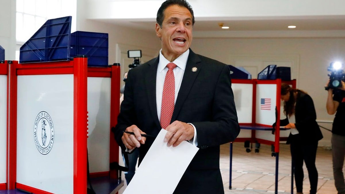 New York Gov. Andrew Cuomo speaks as he marks his primary election ballot at the Presbyterian Church of Mount Kisco, in Mount Kisco, N.Y., Thursday, Sept. 13, 2018. (AP Photo/Richard Drew)