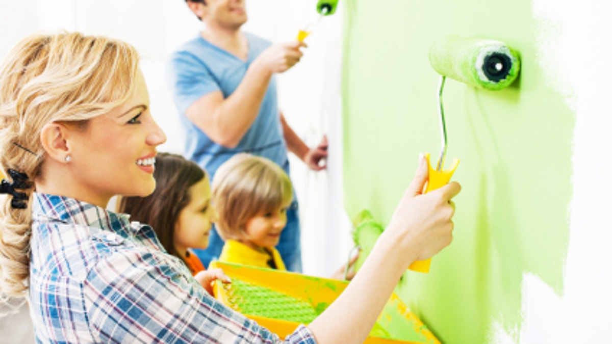 f58db758-Happy family painting walls.