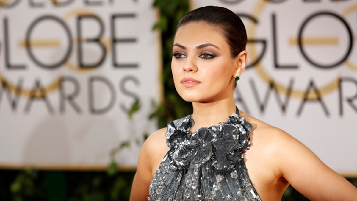 Actress Mila Kunis arrives at the 71st annual Golden Globe Awards in Beverly Hills, California January 12, 2014. REUTERS/Mario Anzuoni (UNITED STATES - Tags: Entertainment)(GOLDENGLOBES-ARRIVALS) - RTX17BFE
